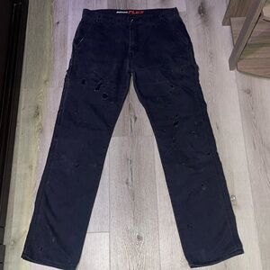 Dark grey dickies flex cargo with rips and small bleach stains